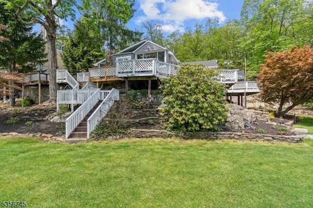 229A Squaw Trl, Hopatcong Boro, NJ 07821 - back of property with stairs, a yard, and a deck