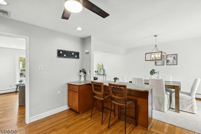 9 Copperfield Rd, Scotch Plains Twp, NJ 07076 - bar area featuring light wood finished floors, ceiling fan, a chandelier, baseboards, and hanging light fixtures