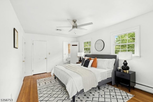 9 Copperfield Rd, Scotch Plains Twp, NJ 07076 - bedroom with wood finished floors, a baseboard radiator, ensuite bathroom, and a ceiling fan
