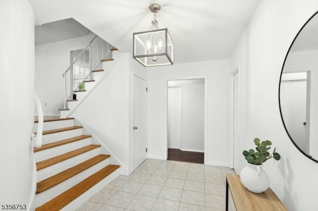 9 Copperfield Rd, Scotch Plains Twp, NJ 07076 - foyer entrance featuring a chandelier, stairway, and light tile patterned floors
