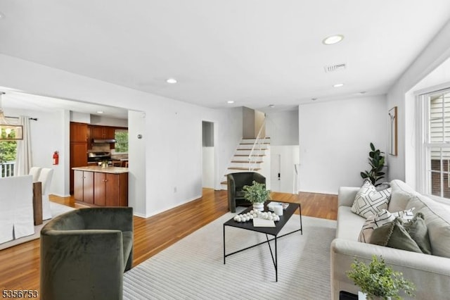 9 Copperfield Rd, Scotch Plains Twp, NJ 07076 - living room featuring plenty of natural light, stairway, recessed lighting, and light wood-style flooring