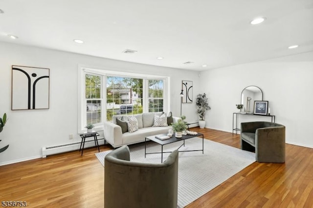 9 Copperfield Rd, Scotch Plains Twp, NJ 07076 - living area with baseboard heating, wood finished floors, and recessed lighting