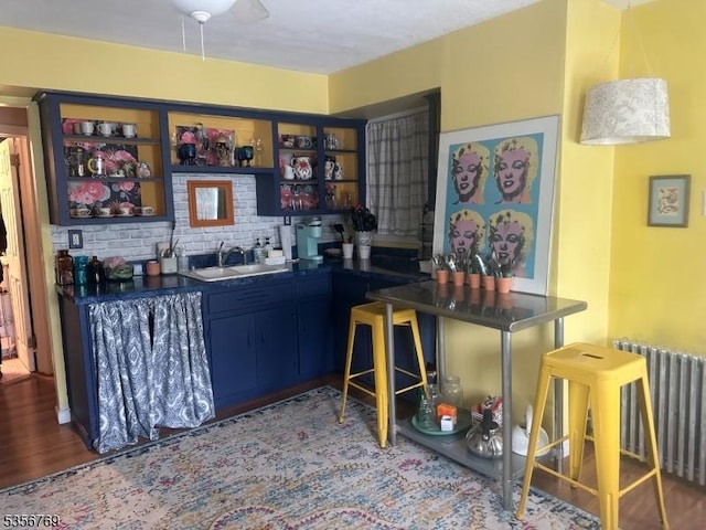 41 Central Ave, Caldwell Boro Twp, NJ 07006 - bar featuring a sink, radiator heating unit, and wood finished floors