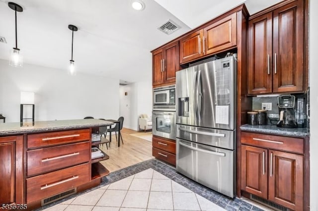 kitchen featuring stainless steel appliances, decorative light fixtures, light tile patterned floors, tasteful backsplash, and recessed lighting