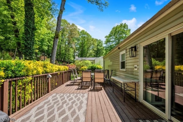 deck with outdoor dining space