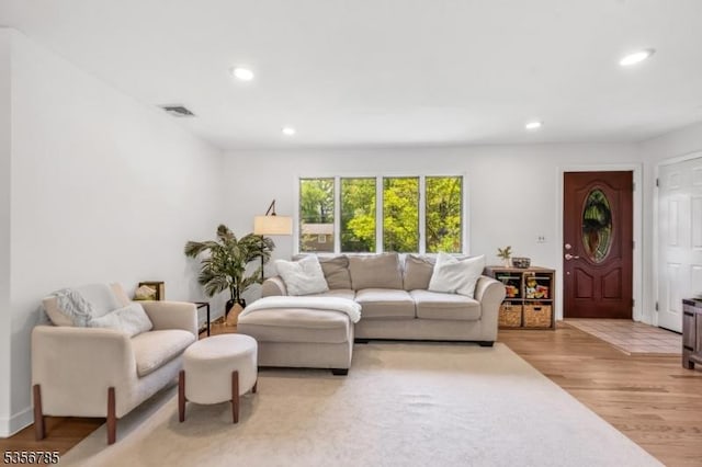 living area featuring recessed lighting and light wood-type flooring