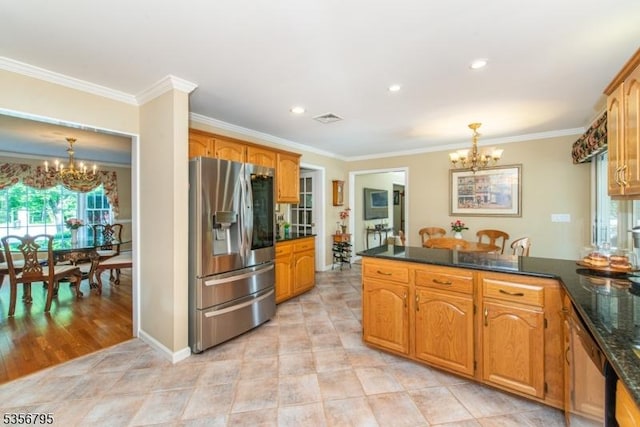 kitchen with stainless steel fridge with ice dispenser, a chandelier, a peninsula, ornamental molding, and pendant lighting