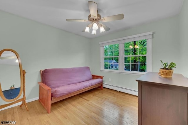 38 Nestlingwood Dr, Washington Twp, NJ 07853 - living area featuring a baseboard heating unit, light wood-style floors, ceiling fan, and baseboards