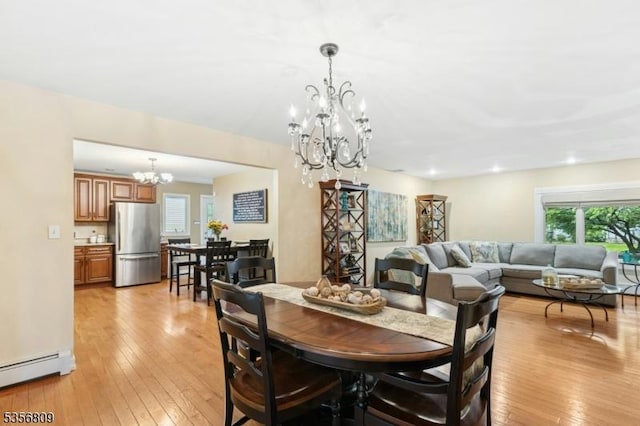 96 Belmont Ave, Cranford Twp, NJ 07016 - dining room with a chandelier, a baseboard radiator, and light wood-style floors