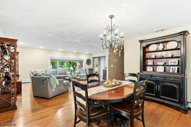 96 Belmont Ave, Cranford Twp, NJ 07016 - dining room with a chandelier, light wood-type flooring, and baseboard heating