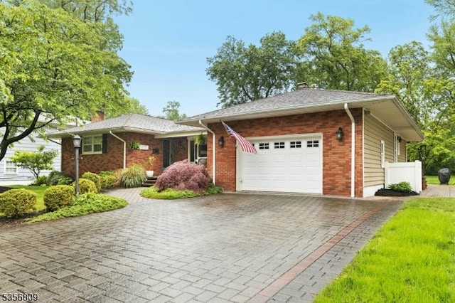 96 Belmont Ave, Cranford Twp, NJ 07016 - ranch-style home with a chimney, a garage, decorative driveway, and brick siding