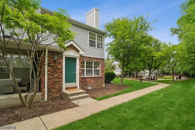 804 Appleton Way, Hanover Twp, NJ 07981 - view of front of home with brick siding, a front yard, a chimney, and entry steps