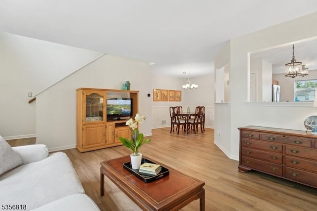 804 Appleton Way, Hanover Twp, NJ 07981 - living room with a chandelier, light wood-style flooring, and baseboards