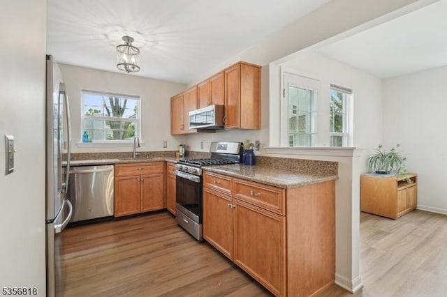 804 Appleton Way, Hanover Twp, NJ 07981 - kitchen with appliances with stainless steel finishes, light wood finished floors, plenty of natural light, and a sink