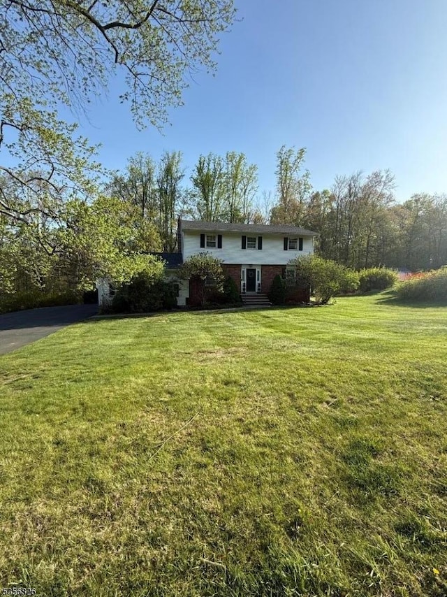 29 Dogwood Trl, Randolph Twp, NJ 07869 - view of front facade with brick siding and a front lawn