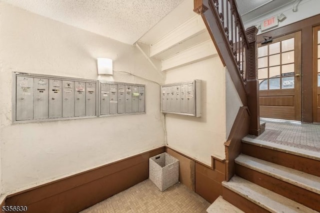 7505 Palisade Ave, North Bergen Twp, NJ 07047 - stairway featuring mail area and a textured ceiling