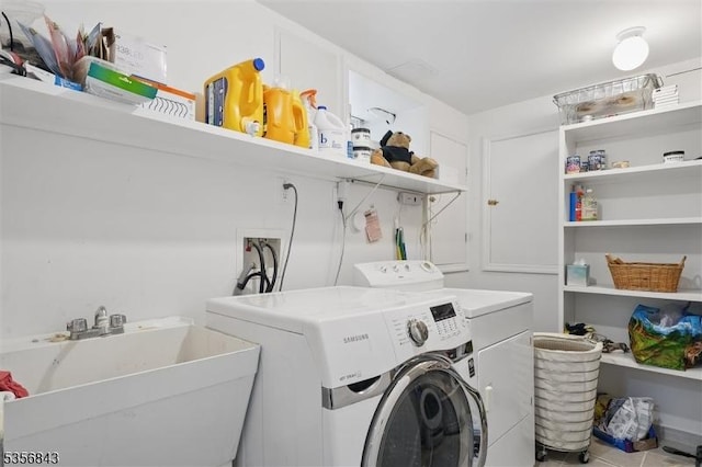 washroom with washing machine and dryer