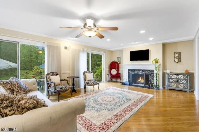 147 Liberty Corner Rd, Bernards Twp, NJ 07920 - living area with healthy amount of natural light, a high end fireplace, crown molding, a ceiling fan, and wood finished floors