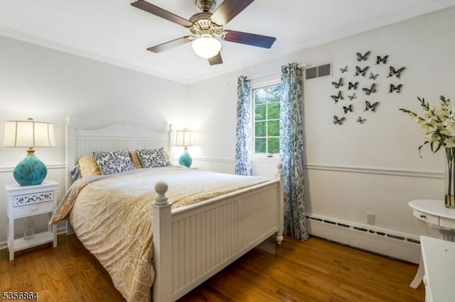 147 Liberty Corner Rd, Bernards Twp, NJ 07920 - bedroom with a baseboard heating unit, wood finished floors, crown molding, and a ceiling fan
