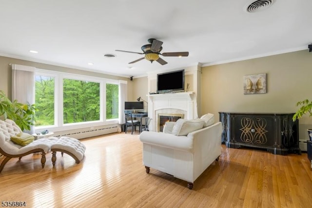 147 Liberty Corner Rd, Bernards Twp, NJ 07920 - living room with a glass covered fireplace, crown molding, wood finished floors, a ceiling fan, and a baseboard radiator
