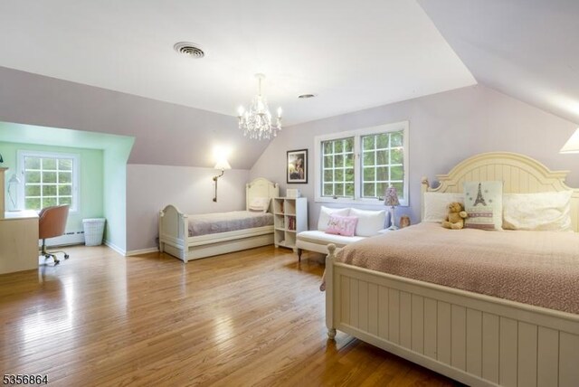 147 Liberty Corner Rd, Bernards Twp, NJ 07920 - bedroom with vaulted ceiling, baseboard heating, wood finished floors, and a chandelier