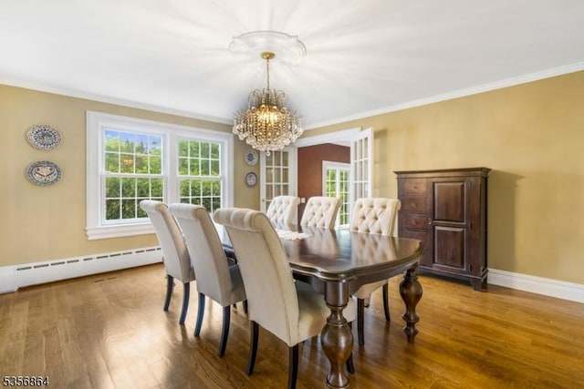 147 Liberty Corner Rd, Bernards Twp, NJ 07920 - dining room with a chandelier, a baseboard radiator, wood finished floors, ornamental molding, and baseboards