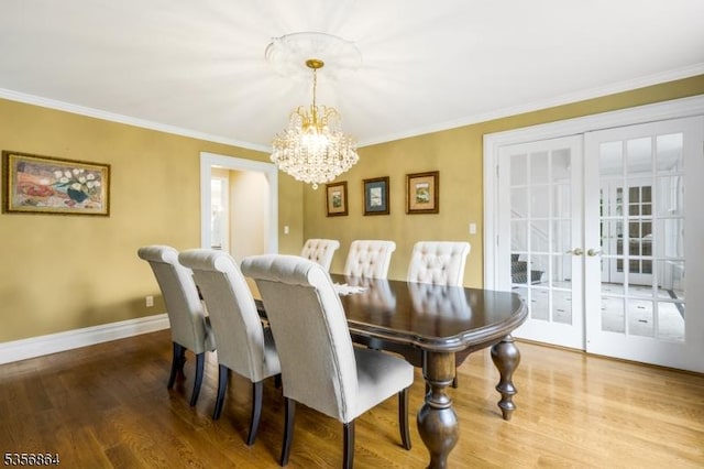 147 Liberty Corner Rd, Bernards Twp, NJ 07920 - dining room featuring a chandelier, french doors, wood finished floors, crown molding, and baseboards