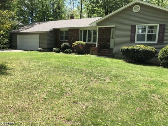 89 Ridge Rd, Jefferson Twp, NJ 07438 - ranch-style house with a garage, a front yard, brick siding, and driveway
