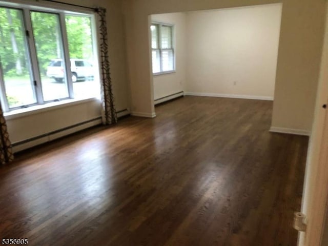 89 Ridge Rd, Jefferson Twp, NJ 07438 - unfurnished room with dark wood finished floors, baseboard heating, and baseboards