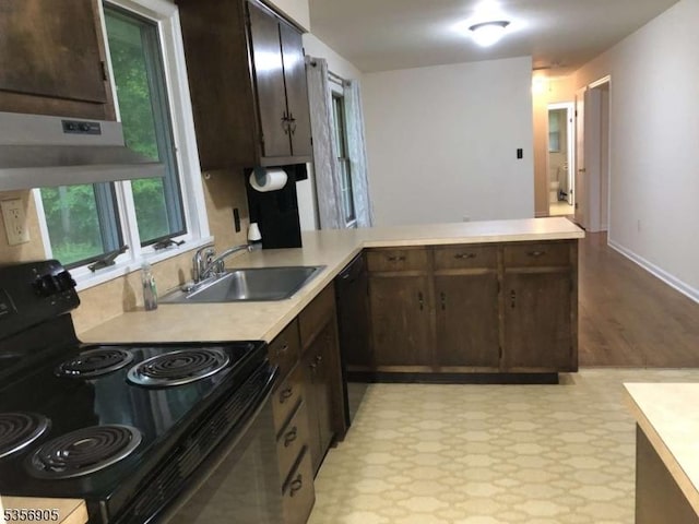 89 Ridge Rd, Jefferson Twp, NJ 07438 - kitchen with black appliances, a sink, light countertops, and dark brown cabinetry