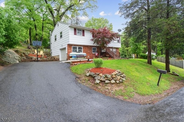 8 Hillside Ter, Green Twp, NJ 07821 - view of front of house featuring an attached garage, driveway, stairway, and brick siding