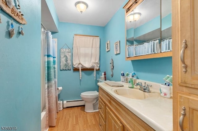 8 Hillside Ter, Green Twp, NJ 07821 - full bathroom with a baseboard heating unit, wood finished floors, toilet, curtained shower, and vanity