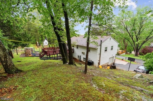 8 Hillside Ter, Green Twp, NJ 07821 - view of grassy yard featuring an attached garage and driveway