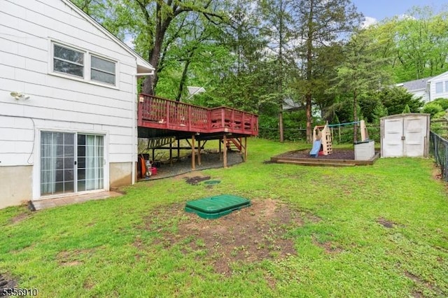 8 Hillside Ter, Green Twp, NJ 07821 - view of yard with a playground, a deck, a shed, an outdoor structure, and view of wooded area