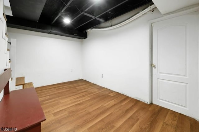 finished basement with light wood-type flooring