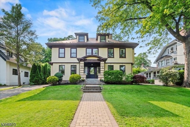 12 Harrison Ave, Montclair Twp, NJ 07042 - view of front facade with a front lawn and stucco siding