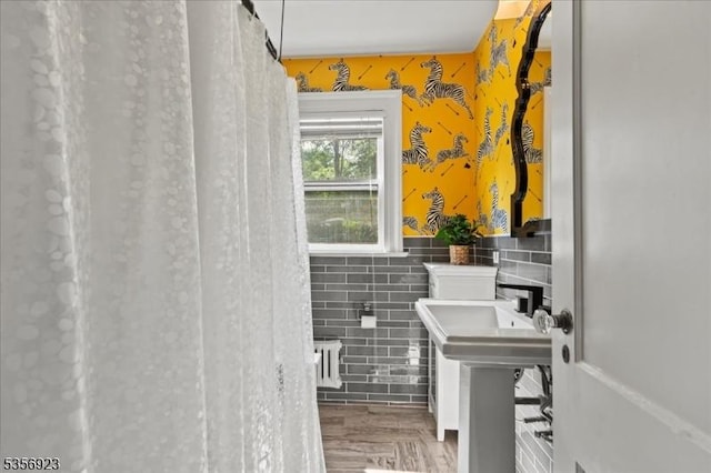 12 Harrison Ave, Montclair Twp, NJ 07042 - bathroom featuring tile walls, a wainscoted wall, and wood finished floors