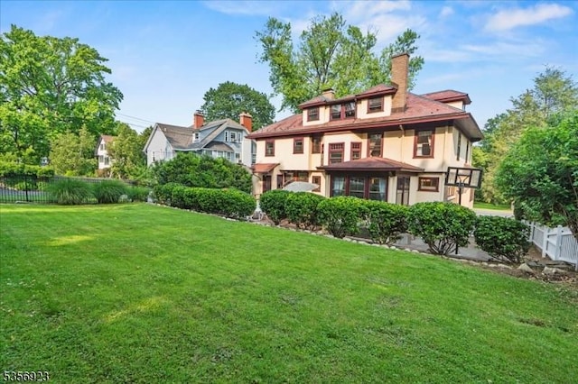 12 Harrison Ave, Montclair Twp, NJ 07042 - back of house featuring a chimney and stucco siding