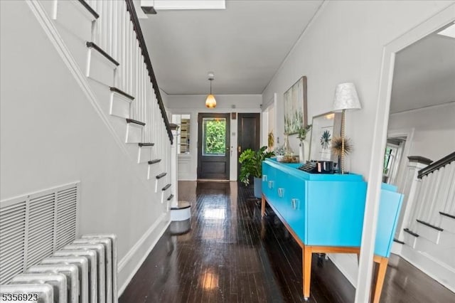 12 Harrison Ave, Montclair Twp, NJ 07042 - foyer entrance with radiator, stairway, wood-type flooring, and baseboards