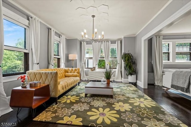 12 Harrison Ave, Montclair Twp, NJ 07042 - living area with wood finished floors, a chandelier, crown molding, and baseboards