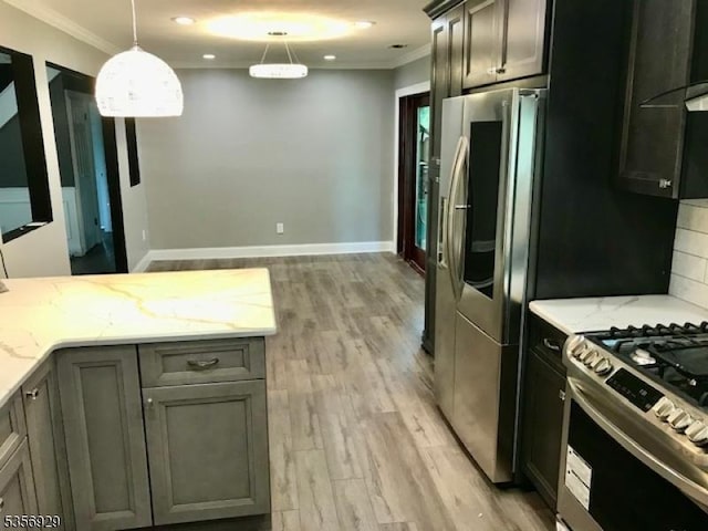 10 Evergreen Rd, Franklin Twp, NJ 08873 - kitchen with appliances with stainless steel finishes, ornamental molding, light stone counters, light wood-style floors, and hanging light fixtures