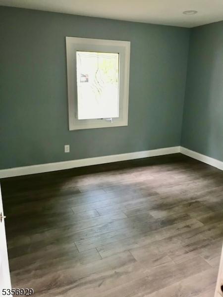 10 Evergreen Rd, Franklin Twp, NJ 08873 - spare room featuring baseboards and wood finished floors