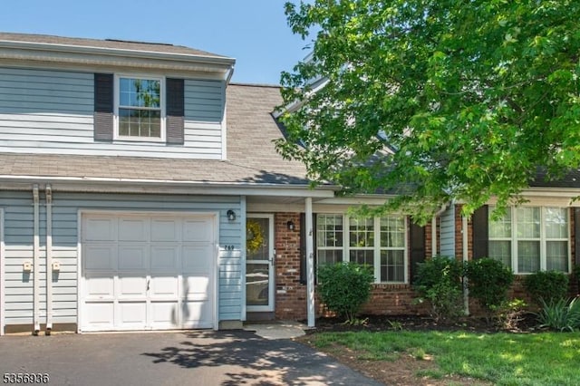 269 Edgeware Ct, Franklin Twp, NJ 08873 - view of front of house with a garage, brick siding, and driveway