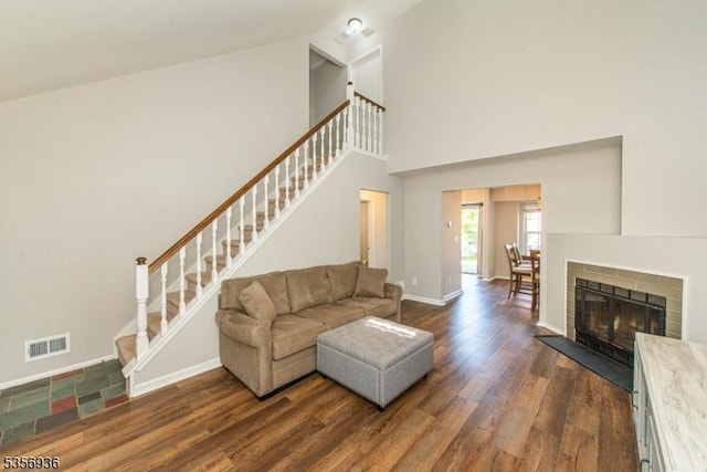 269 Edgeware Ct, Franklin Twp, NJ 08873 - living area featuring dark wood-style flooring, stairs, a high ceiling, and baseboards