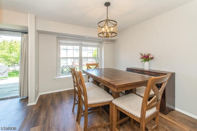 269 Edgeware Ct, Franklin Twp, NJ 08873 - dining area with a chandelier, wood finished floors, baseboards, and healthy amount of natural light