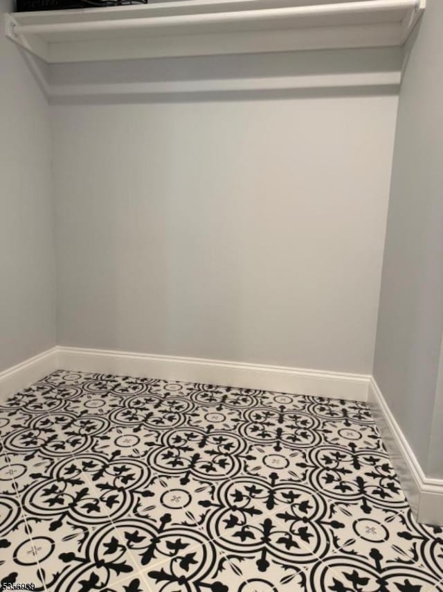 spacious closet featuring tile patterned floors