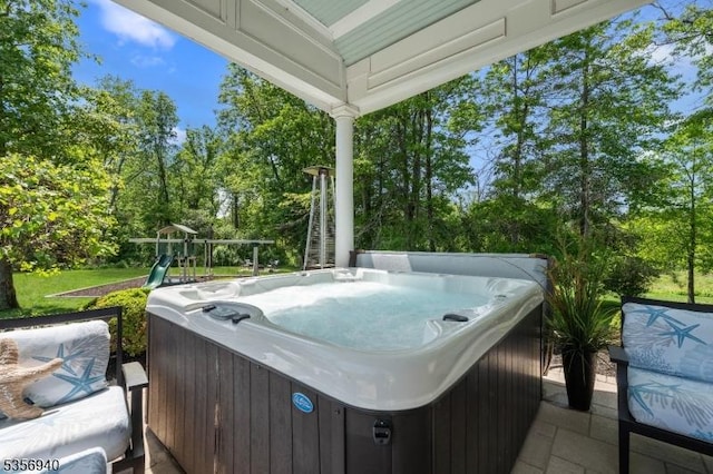 28 Handler Ct, Montgomery Twp, NJ 08502 - view of patio / terrace featuring a hot tub, a grill, and view of wooded area