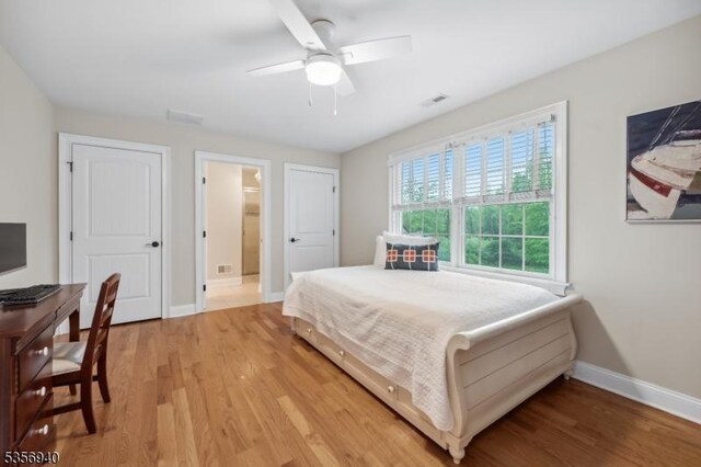 28 Handler Ct, Montgomery Twp, NJ 08502 - bedroom with baseboards, light wood-style floors, ceiling fan, and ensuite bath