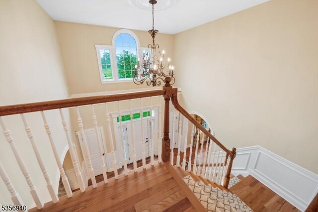 28 Handler Ct, Montgomery Twp, NJ 08502 - staircase with wood finished floors and a chandelier