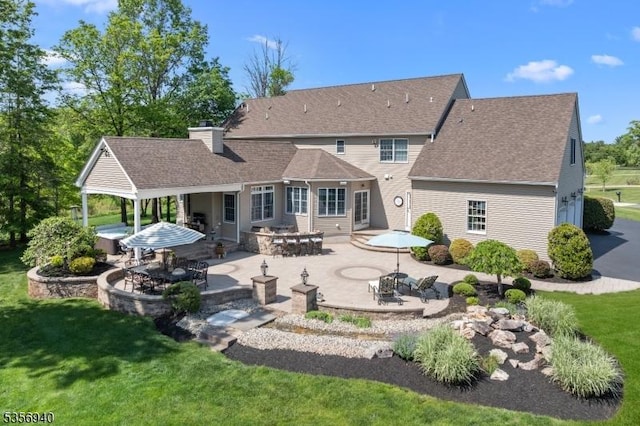 28 Handler Ct, Montgomery Twp, NJ 08502 - rear view of property featuring a patio, a chimney, and a lawn